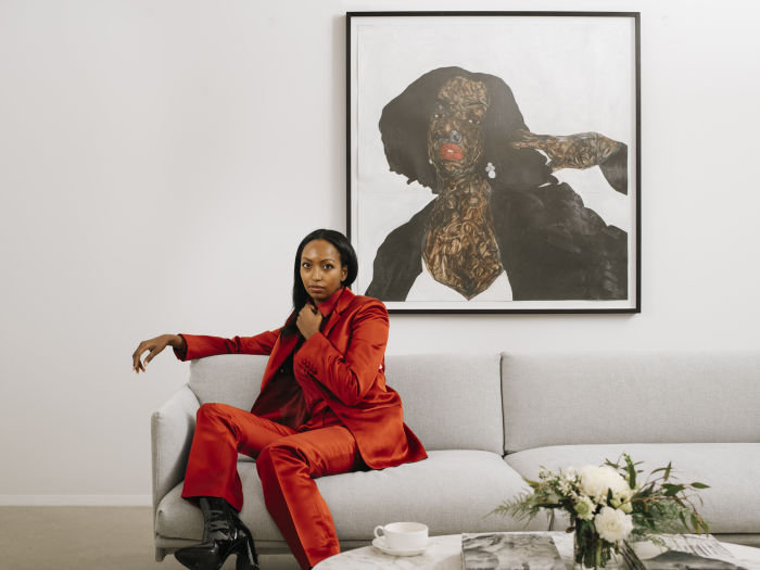 Mariane Ibrahim photographed for The FT by Dave Kasnic, at her gallery in Chicago. Artwork behind her: Amoako Boafo, Follow Monica, 2019