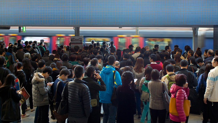 KAR84X crowd of passengers are waiting in hong kong