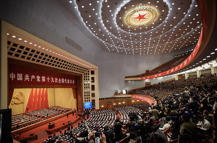 BEIJING, CHINA - OCTOBER 18: A general view of the Great Hall of the People as Chinese President Xi Jinping delivers a speech during the opening session of the 19th Communist Party Congress on October 18, 2017 in Beijing, China. The 19th Communist Party Congress will convene from October 18-24. (Photo byBEIJING, CHINA - OCTOBER 18: Chinese President Xi Jinping (L) shake hands China's former president Jiang Zemin (R) at the opening session of the Chinese Communist Party's Congress at the Great Hall of the People on October 18, 2017 in Beijing, China. The 19th Communist Party Congress will convene from October 18-24. (Photo by Lintao Zhang/Getty Images)y Images)