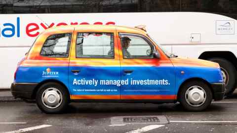 DY6TP4 A London taxi advertising Jupiter Asset Management Investment institution, London UK