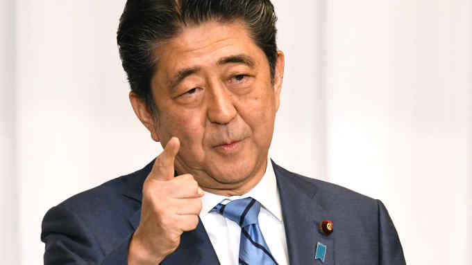 Japan's Prime Minister Shinzo Abe delivers a speech during a debate for the Liberal Democratic Party presidential election with former Defense Minister Shigeru Ishiba at the party's headquarters in Tokyo on September 10, 2018. - Japan's Shinzo Abe September 10 defended his economic record and pledged a controversial reform of the post-war constitution, as he launched his campaign for another term as head of his ruling LDP party. (Photo by Kazuhiro NOGI / AFP) (Photo credit should read KAZUHIRO NOGI/AFP/Getty Images)