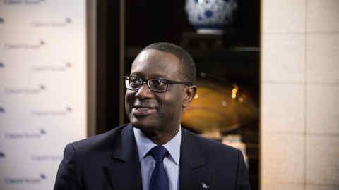 Tidjane Thiam, chief executive officer of Credit Suisse Group AG, speaks during a Bloomberg Television interview in Beijing, China, on Friday, Aug. 31, 2018. Thiam signaled he's optimistic that the global economy will withstand escalating trade tensions and deepening woes in emerging markets such as Argentina and Turkey. Thiam signaled he's optimistic that the global economy will withstand escalating trade tensions and deepening woes in emerging markets such as Argentina and Turkey. Photographer: Giulia Marchi/Bloomberg
