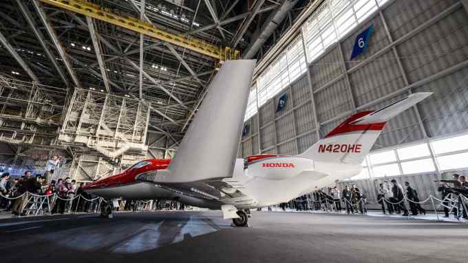 A Honda Motor Co. HondaJet aircraft stands in a hangar during a media preview at Haneda Airport in Tokyo, Japan, on Thursday, April 23, 2015. Honda's first jet plane made its maiden Japanese flight as the company seeks to boost its reputation for cutting-edge technology. Photographer: Akio Kon/Bloomberg