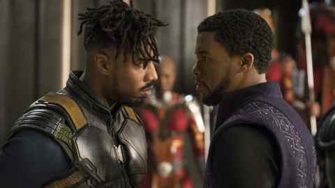 Michael B. Jordan as Erik Killmonger (left)  and Chadwick Boseman as T'Challa/Black Panther
