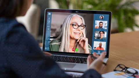 Multiethnic business team having discussion in video call. Rear view of business woman in video conference with boss and his colleagues during online meeting. Senior woman in video call with partners.; Shutterstock ID 1676998312; Department: -; Job/Project: -; Employee Name: -
