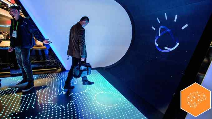 A man walks through the Watson Premier display to learn about IBM Watson at CES in Las Vegas, Nevada, January 9, 2018. / AFP PHOTO / DAVID MCNEW (Photo credit should read DAVID MCNEW/AFP/Getty Images)