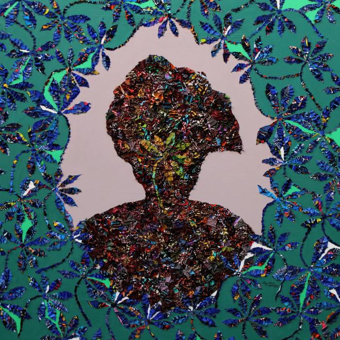 Silhouette head of a person in a frame of blue leaves against a green background
