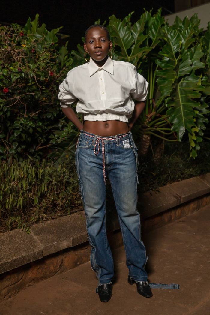 Model in jeans and cropped shirt