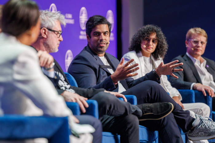 Sachin Dev Duggal, centre, speaking at the Milken Institute conference in May 2024 