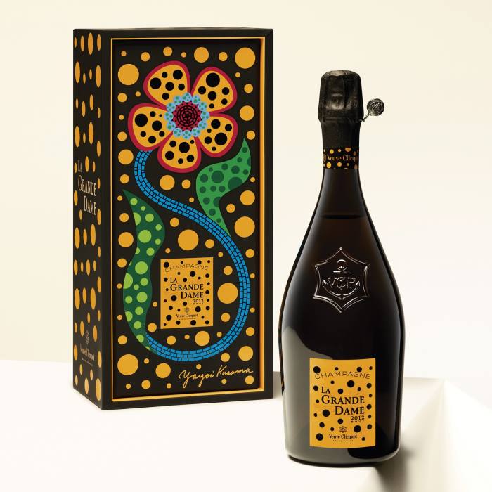 The artist’s trademark dots and flowers also swirl around the vintage’s gift box and label