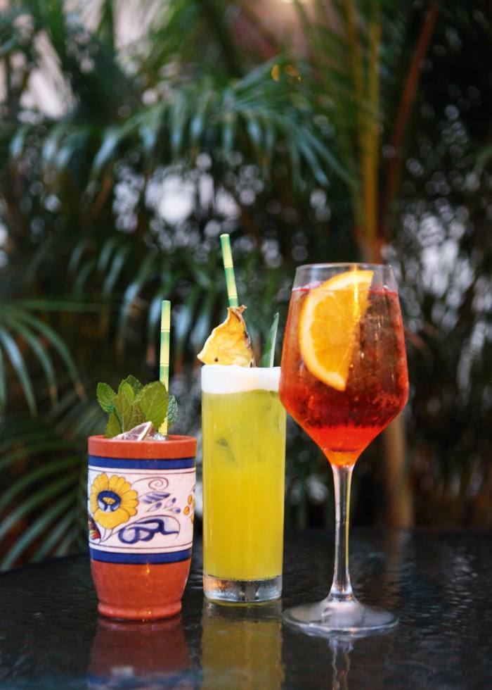 Cocktails at La Bárbara, from left, a Saturn, a Piña Mule “mocktail” and an Aperol Spritz