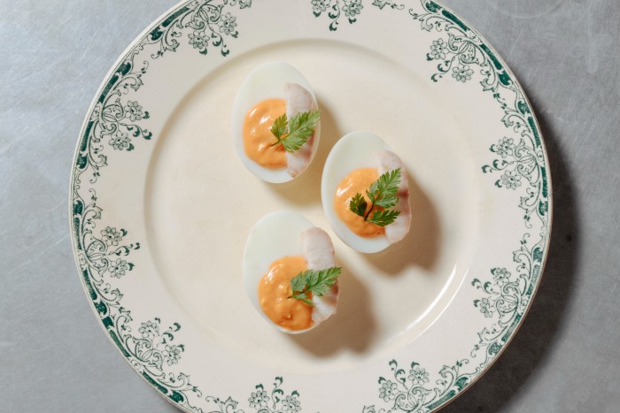 Eggs with slices of smoked eel at Camille in London