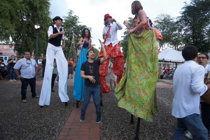Miranda dances with Agua, Sol y Sereno during Fiesta de Pueblo