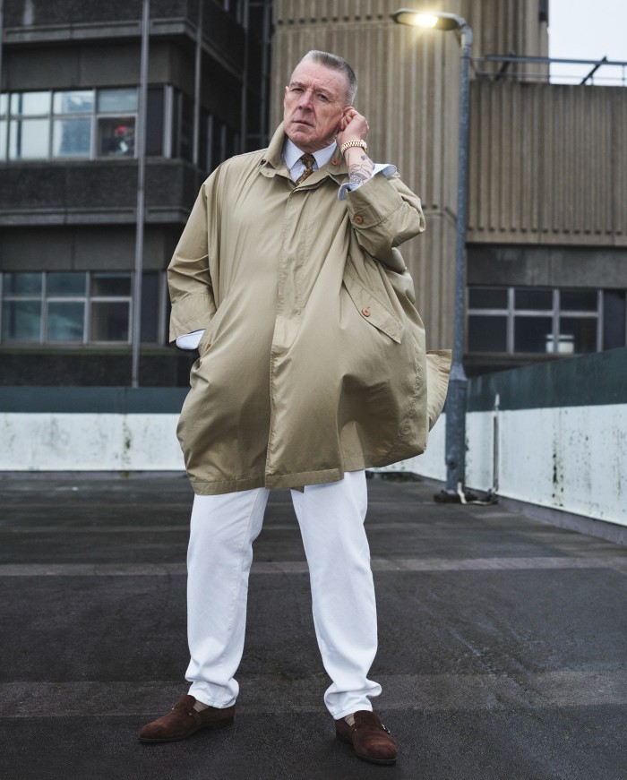 Rich Allen, 64, retired, wears vintage Issey Miyake cotton windcoat, from stylist’s archive. Dunhill cotton shirt (just seen), £475. Noah denim trousers, £240. John Lobb suede shoes, £1,300. Pantherella merino wool socks (just seen), £19.50. Vintage Drake’s silk tie, from stylist’s archive. Vintage Rolex gold watch, POA