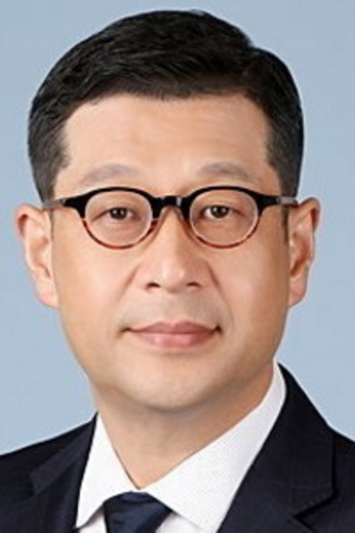 Doil Son. A middle-aged Korean man wearing glasses and a suit