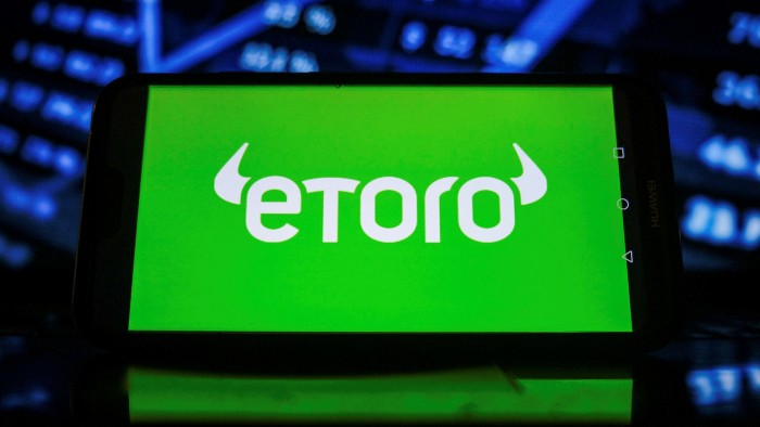 The logo of eToro on a smartphone screen