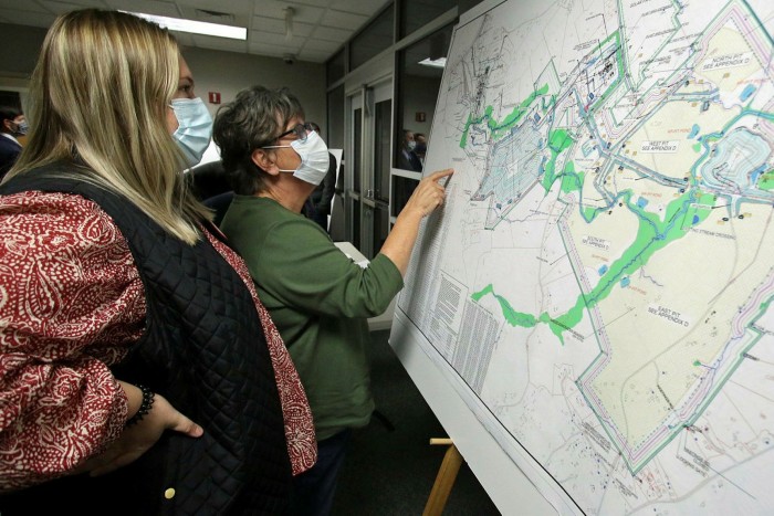Macie Putnam and her mother, Cathi, inspect a map during a Piedmont Lithium public hearing held in November 2021 at the Gaston County Courthouse