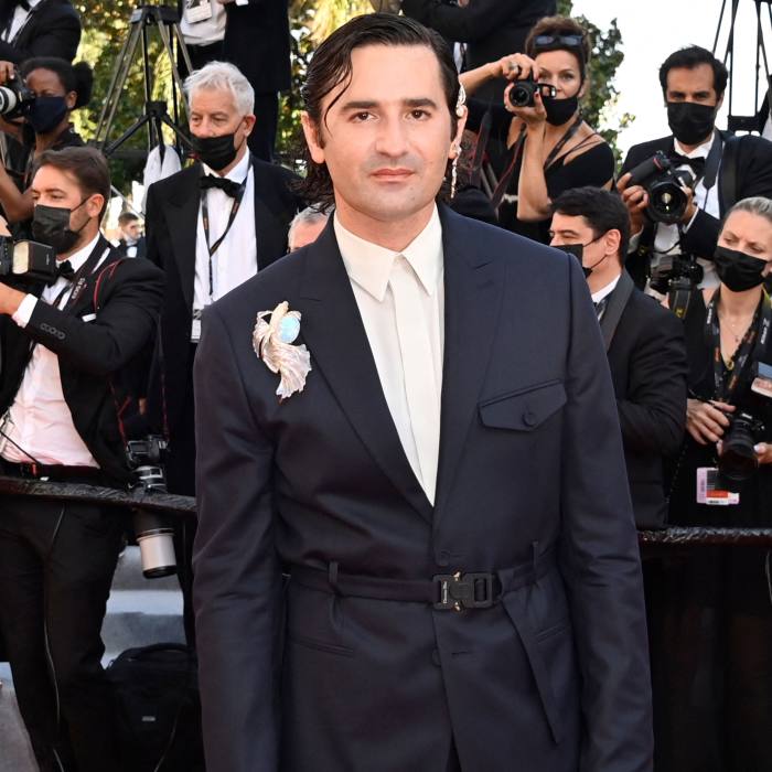 Nicolas Maury wears a Boucheron brooch at Cannes this year