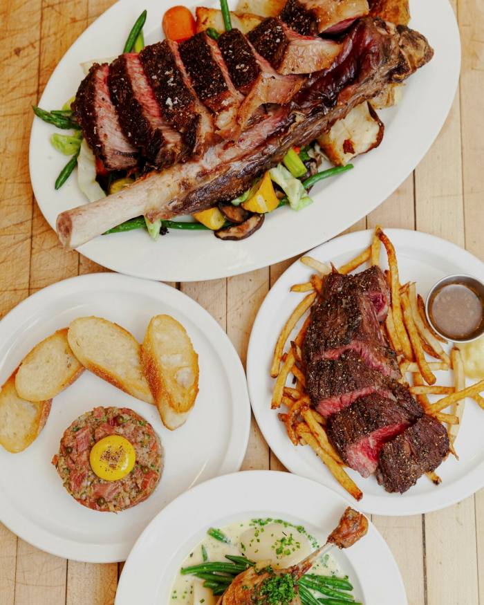 Other French dishes offered by Côte de Boeuf, including steak frites, confit de canard and steak tartare