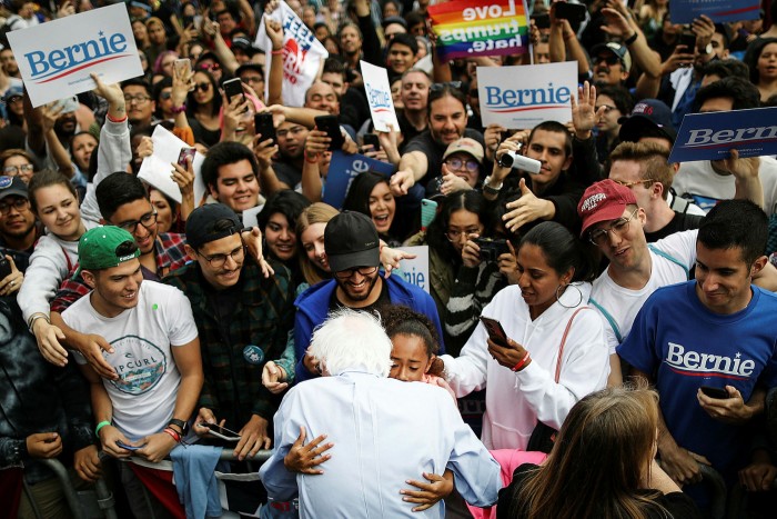 Bernie Sanders, hugging a young supporter at a campaign rally last year, was elevated by millennials to the verge of the Democratic presidential nomination 