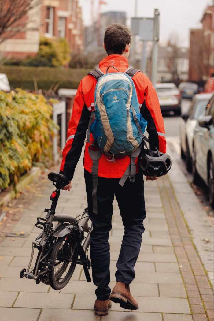 The author wears his own, 15-year-old Deuter backpack and carries the folded-up Brompton T Line