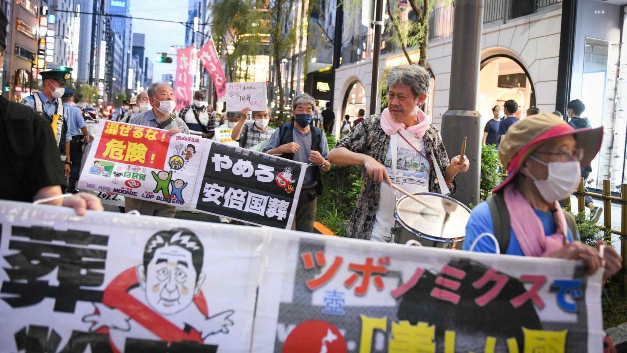 Kishida's popularity hit by decision to hold state funeral for Abe  
