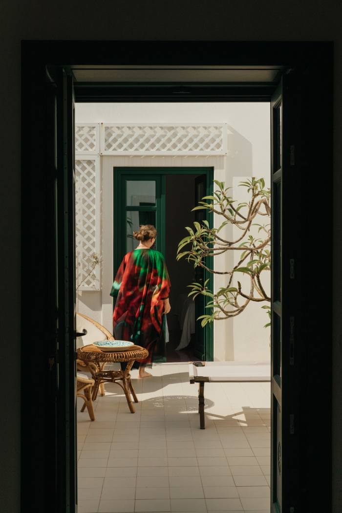 Kapoor in the courtyard, wearing a Dries Van Noten kaftan