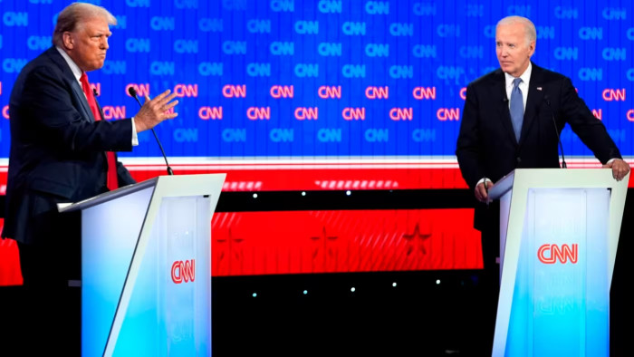 Donald Trump, left and Joe Biden on the CNN debate stage last night