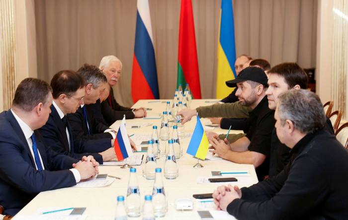 Vladimir Medinsky, the head of the Russian delegation, second left, and Davyd Arakhamia, faction leader of the Servant of the People party in the Ukrainian Parliament, third right, attend the peace talks in the Gomel region, Belarus