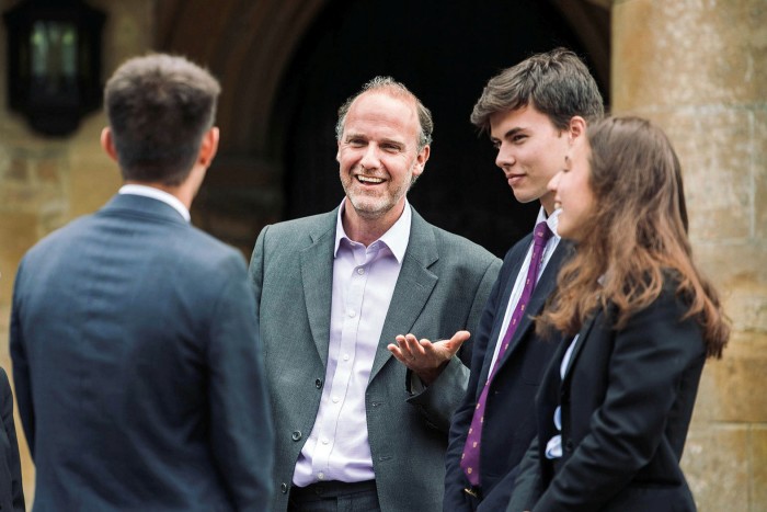 Students with Alex Peterken, headmaster of Charterhouse