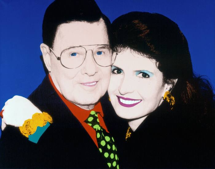 A Warhol-esque painting in bright block colours of a woman hugging a man