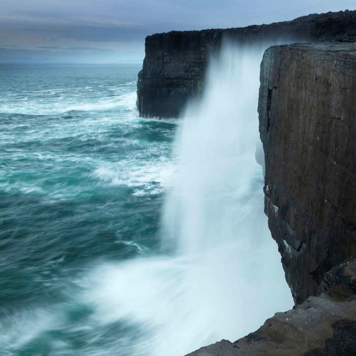 The wild Atlantic batters the cliffs on Inis Meáin