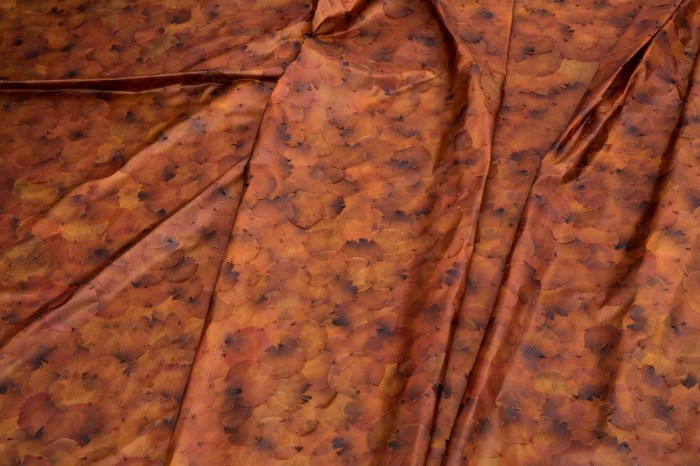 A brown-orangey material in folds