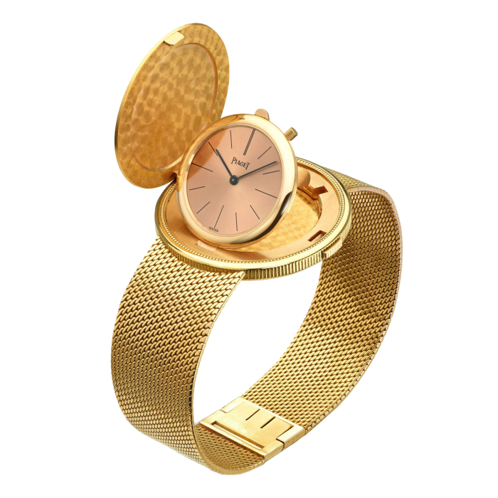 A golden coin watch with a golden strap