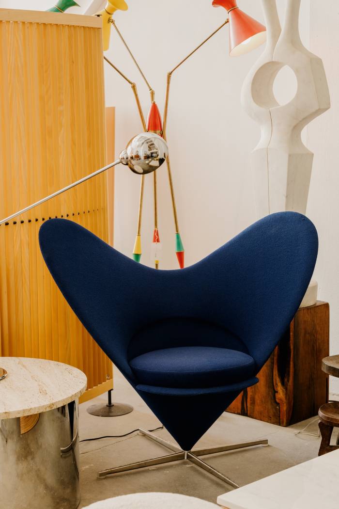 Verner Panton Heart Cone swivel chairs by Vitra, $2,900. Stilnovo three arm enamel floor lamp, $9,500. Chrome counterweight desk lamp by Optelma Switzerland, $1,050