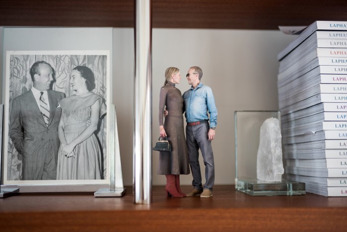 A photo of Austin Hearst’s parents next to a 3D-printed model of him and Gabriela