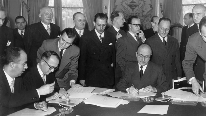 Walter Hallstein, head of the German delegation for negotiations concerning the ECSC (European Coal and Steel Community), and Jean Monnet, future president of the High Authority of the ECSC and representing France, signing the Schuman Declaration on March 19 1951 in Paris, France