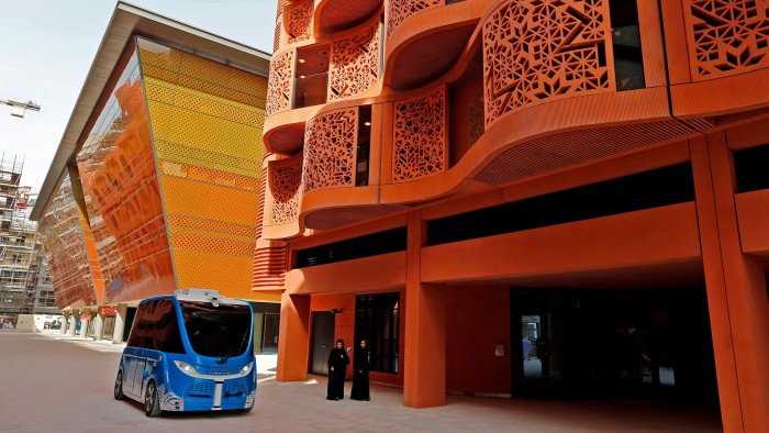 A driverless vehicle in a street at the site of Masdar City
