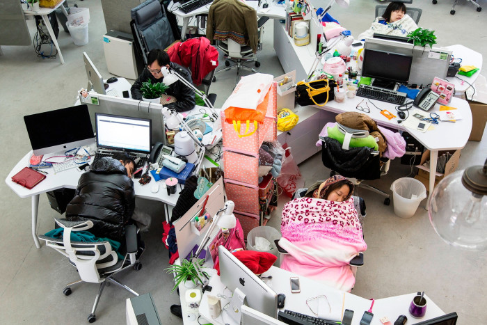 Employees take naps during lunch hour at Tencent in Guangzhou, China