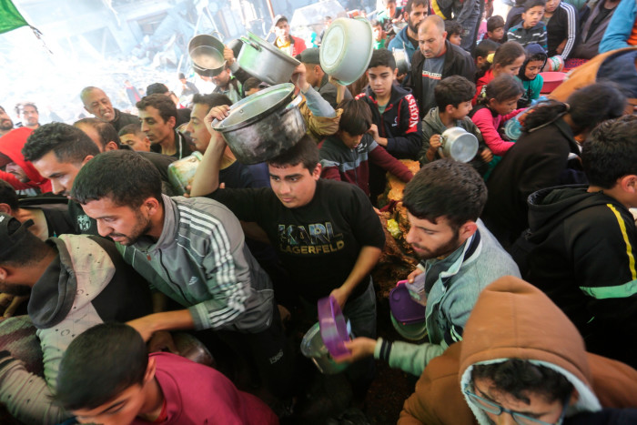 Palestinians wait for food in Rafah, Gaza