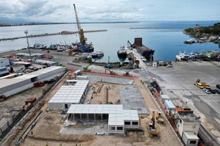 A holding centre for migrants rescued in Italian waters is being constructed in the port of Shëngjin, about 60km north-west of capital Tirana