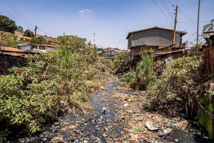 View of a polluted river that passes through Kibera slum, Nairobi, Kenya