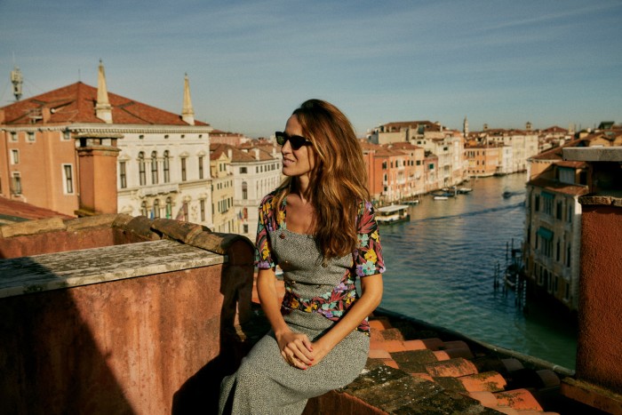 Coco Brandolini d’Adda on the fourth-floor terrace with Venice’s Grand Canal behind her