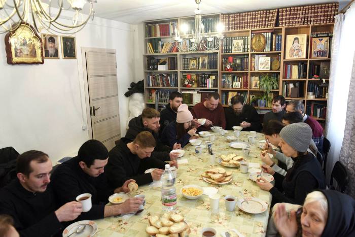Displaced Ukrainians have lunch  at the Resurrection New Athos Monastery in Lviv