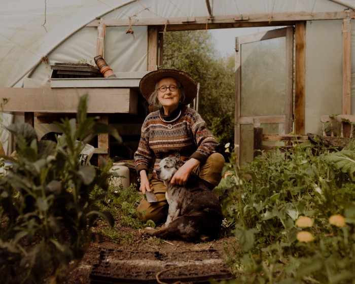With her dog Oswald in the polytunnel