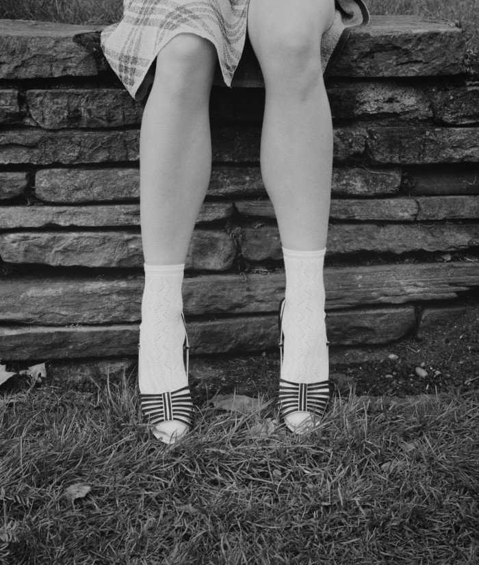 A sense of nostalgia is powerfully felt for s/s 2021. Socks and sandals recall the age of innocence. Iris O’Carroll wears Miu Miu Lurex skirt, £665. Falke cotton-mix socks, £15. Chanel velour sandals, £910
