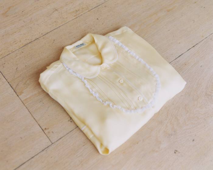 Yellow silk pyjamas from Miu Miu – Lipa also wears them outside