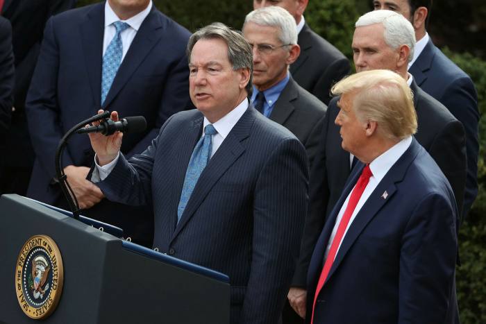 Quest Diagnostics chief executive Steve Rusckowski (centre) at a White House news conference in March, when President Donald Trump (right) announced a national emergency in reaction to the coronavirus pandemic