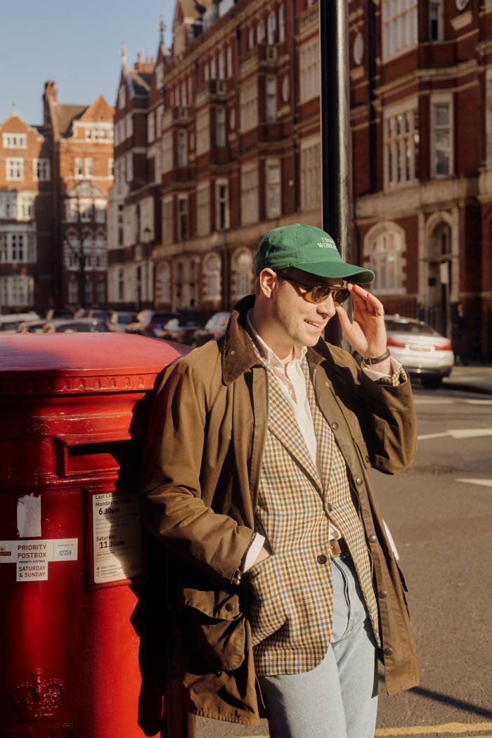 The author wears vintage barbour waxed cotton Solway Zipper jacket, Husbands tweed jacket, £1,100, Drake’s cotton Oxford shirt, £175, and The Row denim jeans, £540, matchesfashion.com. Idea baseball cap, £40. Adret horn sunglasses, POA