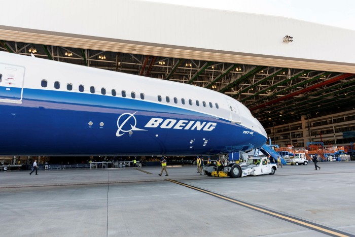 Partial view of a Boeing wide-body 787 aircraft outside a hangar